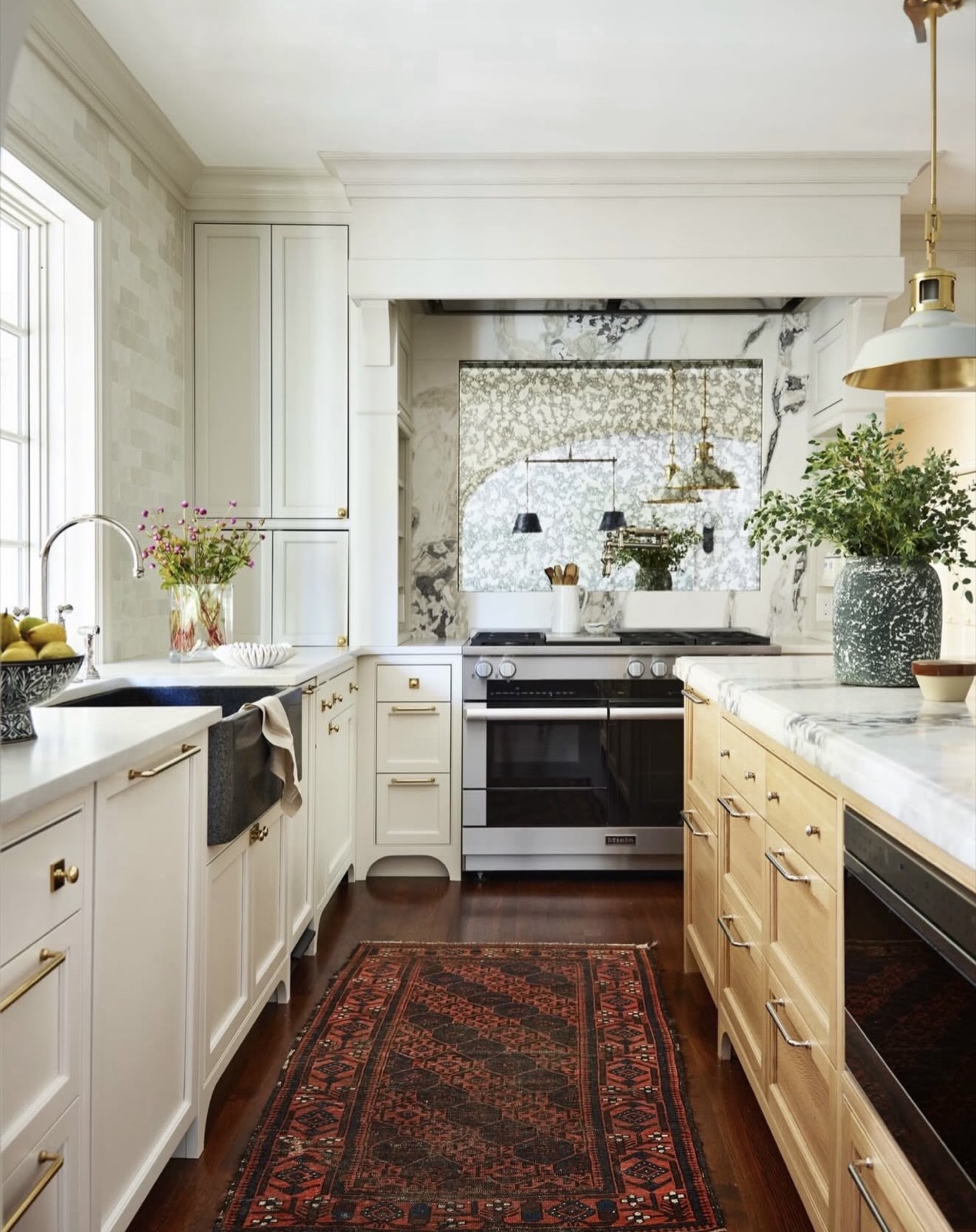 Bright custom kitchen with painted cabinetry and natural oak island